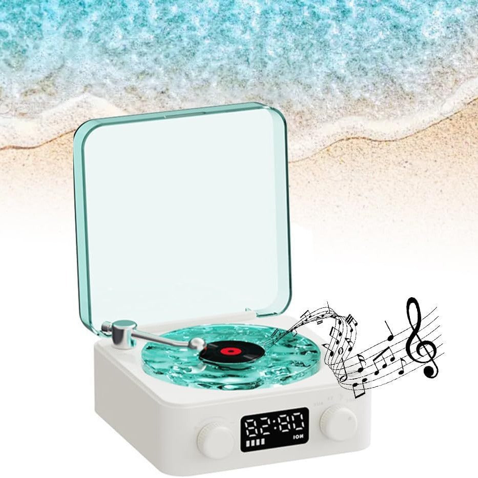 Small portable record player with water-themed design on a beach background